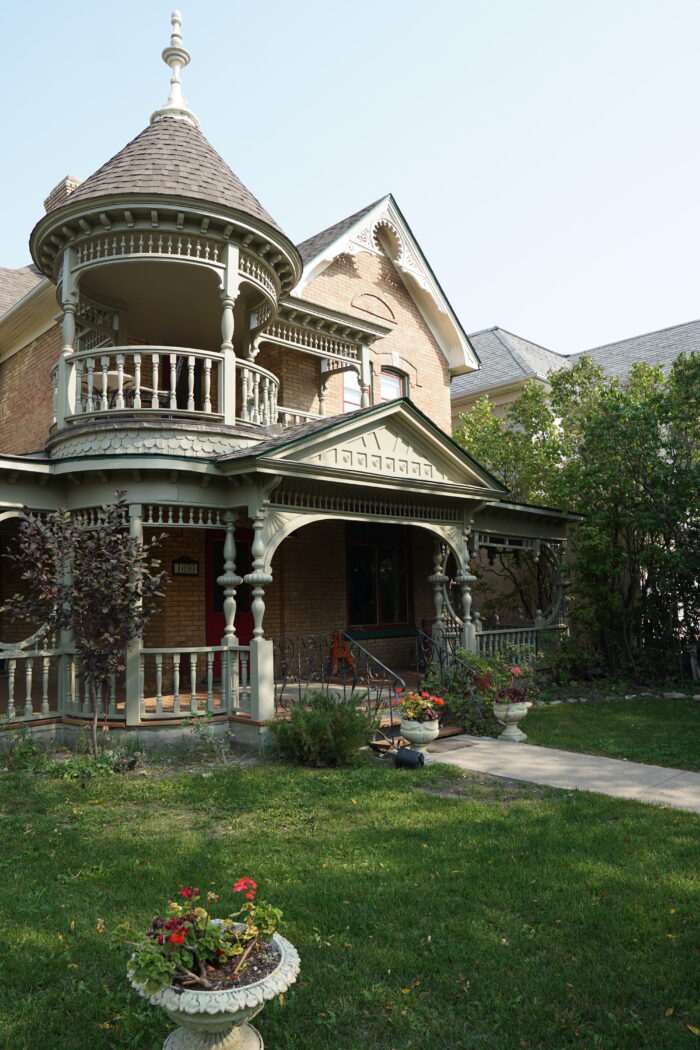 Paterson House with potted flowers in front.