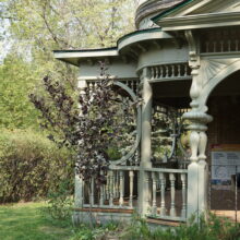 Image 8: Ornate main floor wooden verandah