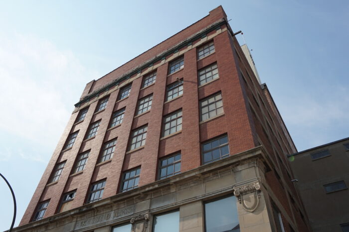 Looking up at the front facade of the McKenzie Building.