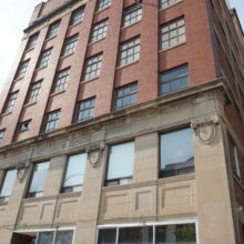 Image 3: Looking up at the front facade of the McKenzie Building.