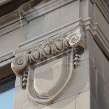 Image 4: Stone banner medallion on main floor of the McKenzie Building