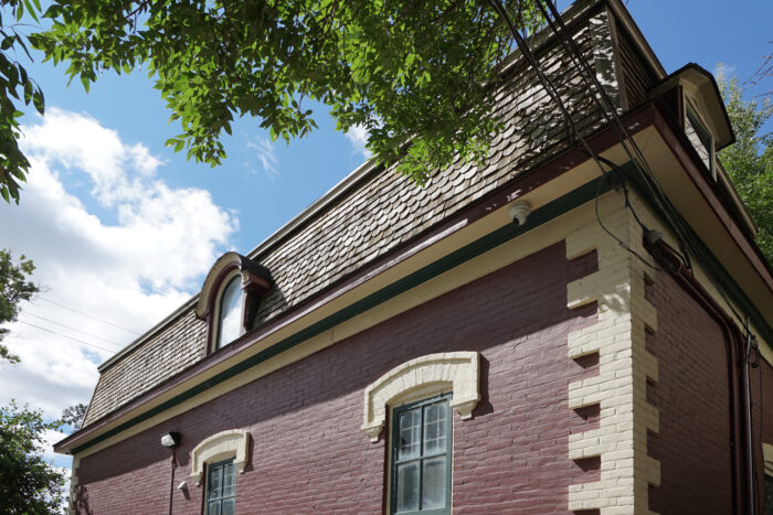 Dormer window on cedar-shingled siding