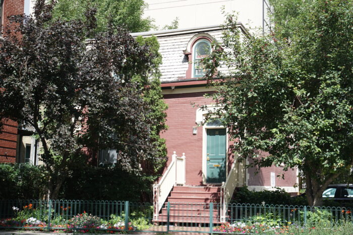 Seven wooden steps leading up to front door of Kerr House entrance