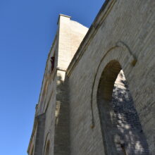 Image 3: A side view of the front entrance of the Trappist Monastery Church.