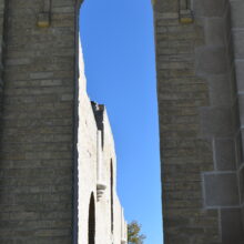 Image 5: A long narrow arched window along the side of the entrance.