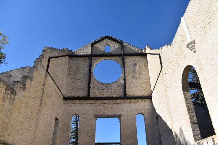 The front facade of the Trappist Monastery Church from the inside. The windows have no glass.