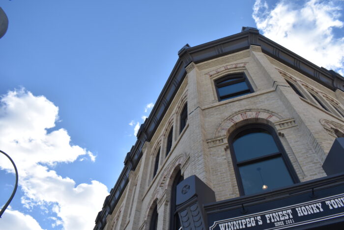 Looking up at the second and third storey windows above the front entrance of the Fortune / Macdonald Block.