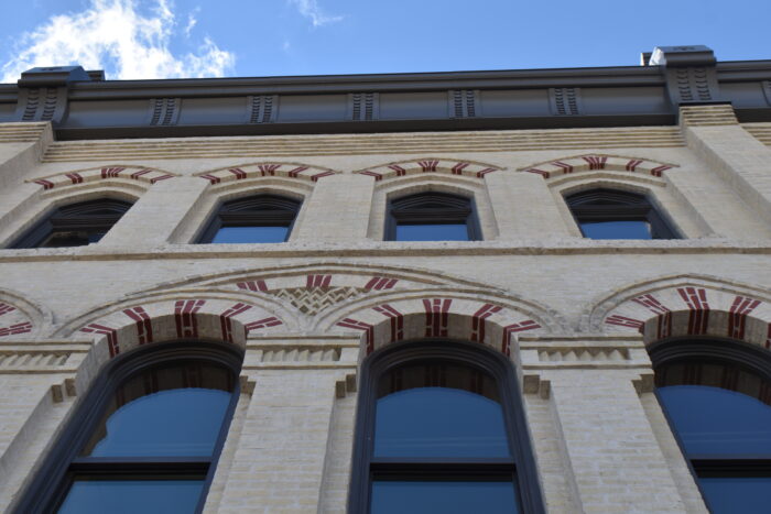 Looking up at the second and third storey windows of the Fortune / Macdonald Block.