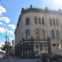 Image 6: The corner facade of the MacDonald Building looking south at the corner of Main Street and St Mary Avenue