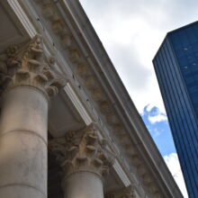 Image 1: Looking up at the capital and cornice details of Winnipeg’s downtown Bank of Montreal building.