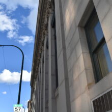 Image 2: Rows of long windows between pilasters topped with decorative cornices.