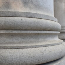 Image 3: Base of a column in front of Winnipeg’s downtown Bank of Montreal building.