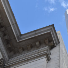 Image 6: Looking up at the cornice details of Winnipeg’s downtown Bank of Montreal building.