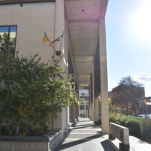 Image 3: Looking down a path that runs through in front of the City Hall facade