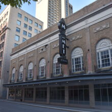 Image 5: Facade of the Metropolitan Theatre with a sign that reads "The Met"