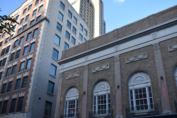 The second storey of Winnipeg’s Metropolitan Theatre with buildings beside and behind it.