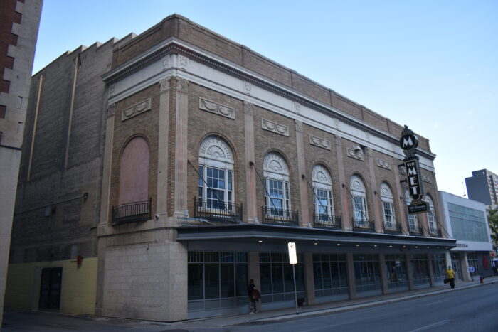 Facade of the Metropolitan Theatre with a sign that says "The Met"