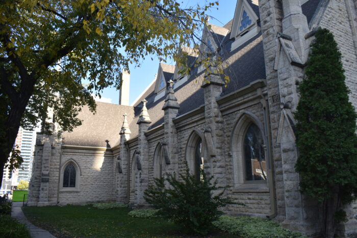 Holy Trinity Church, partly obscured by landscaping in front of it.