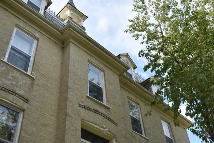 Looking up at the windows above the front entrance of the Sisters of the Holy Name Convent.