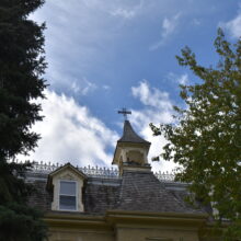 Image 5: Looking up at dormer window and steeple atop building