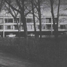 Image 1: Side of Executive Apartments with cars in lower level lot