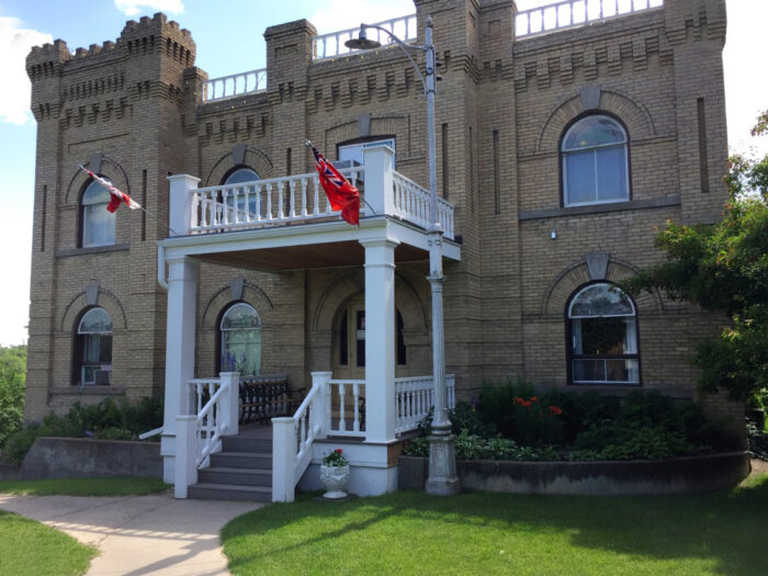 The Hillcrest Museum with two flags mounted above the front entrance.