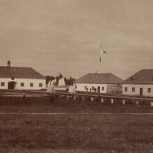 Image 7: Norway house HBC buildings with sails from York boats in yard.