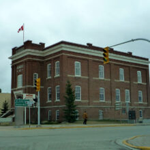 Image 1: Side wall of The Court House with 4 windows on both floors