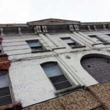 Looking up at the Winnipeg Hotel façade.